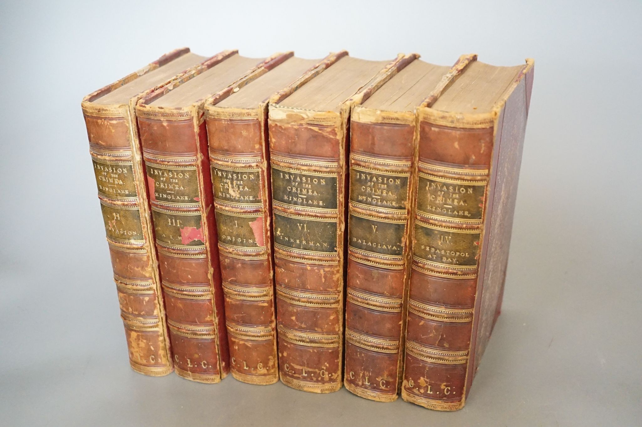 Kinglake, A.W. - The Invasion of the Crimea ... Cabinet Edition, 6 vols, numerous maps and plans (some coloured and folded), half titles; contemp. red half calf and marbled boards, gilt-panelled spines,cr.8vo. 1877